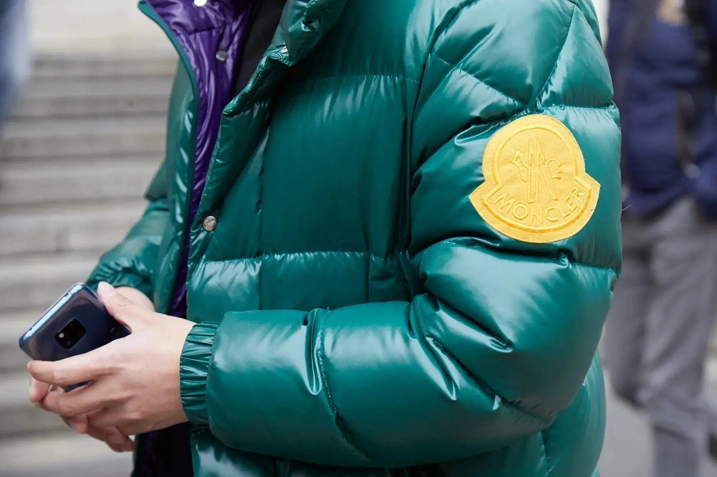 Emerald green Moncler puffer jacket with yellow logo in down jackets guide