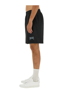 3.paradis men’s bermuda black athletic shorts with white embroidered paradis logo on left thigh for casual wear