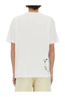 White cotton 3.paradis men’s edgar plans shirt showing the back with a small whimsical cartoon penguin graphic
