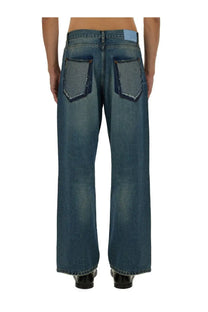 Back side of 3.paradis men’s freedom jeans blue showing faded wash and raw edge stitching on blue denim pockets