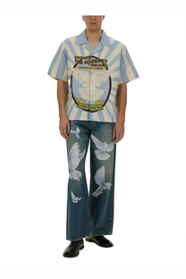 3.paradis men’s freedom jeans blue paired with a light blue and white striped short-sleeved shirt featuring doves and dream text