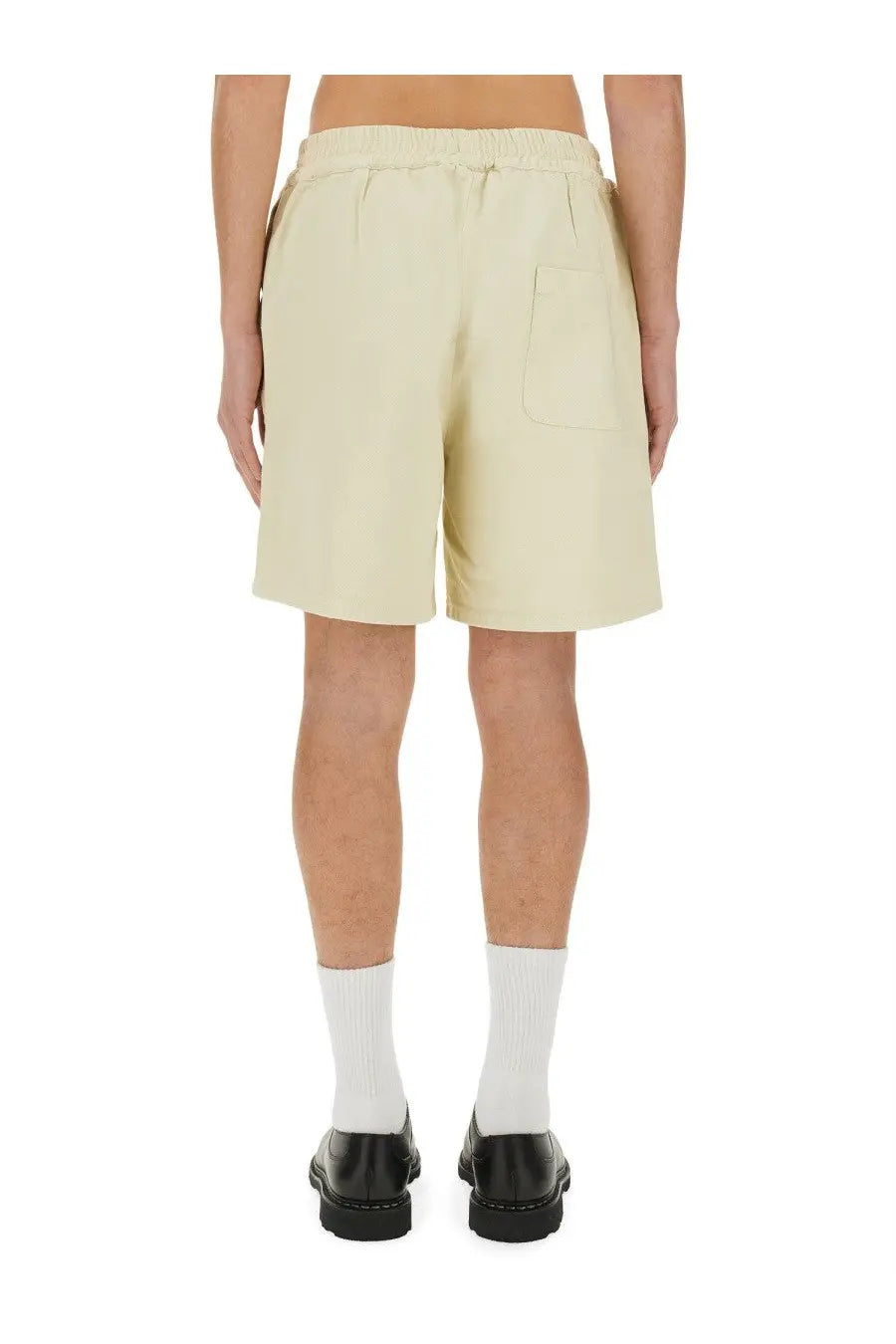 Beige cotton twill 3paradis men’s shorts with elastic waistband and single back pocket shown from the back side