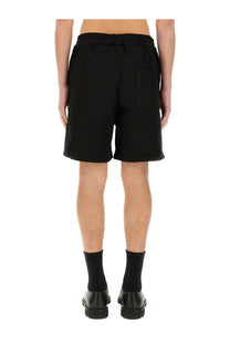 Black cotton twill men’s shorts with elastic waistband and right side patch pocket from 3.paradis