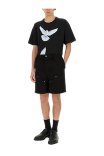 Black 3.paradis men’s short in twill featuring a black short-sleeved t-shirt with a white dove graphic on the chest