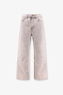 3x1 women’s denim wide-leg jeans in faded light gray wash with subtle distressing and frayed hems