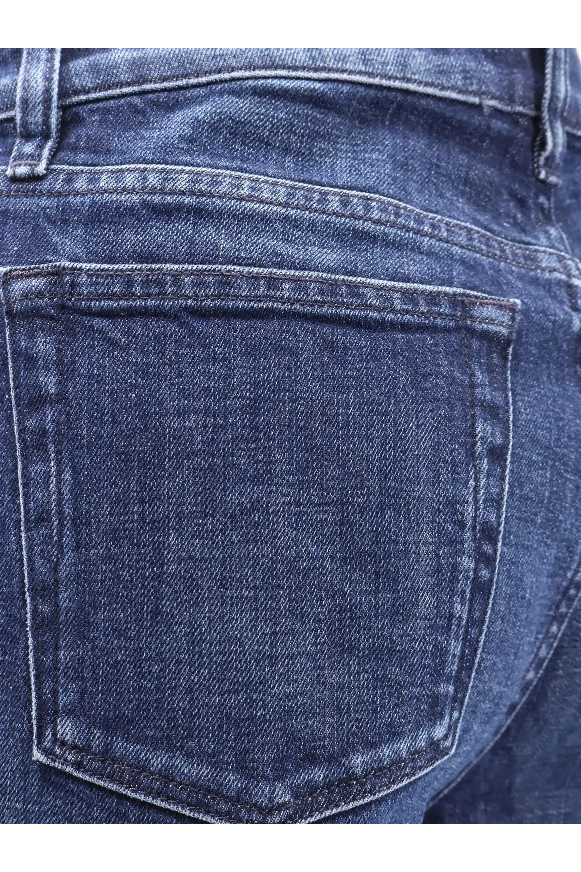 Dark blue 3x1 women’s farrah jeans made of denim with classic back pocket design and visible stitching on the back side