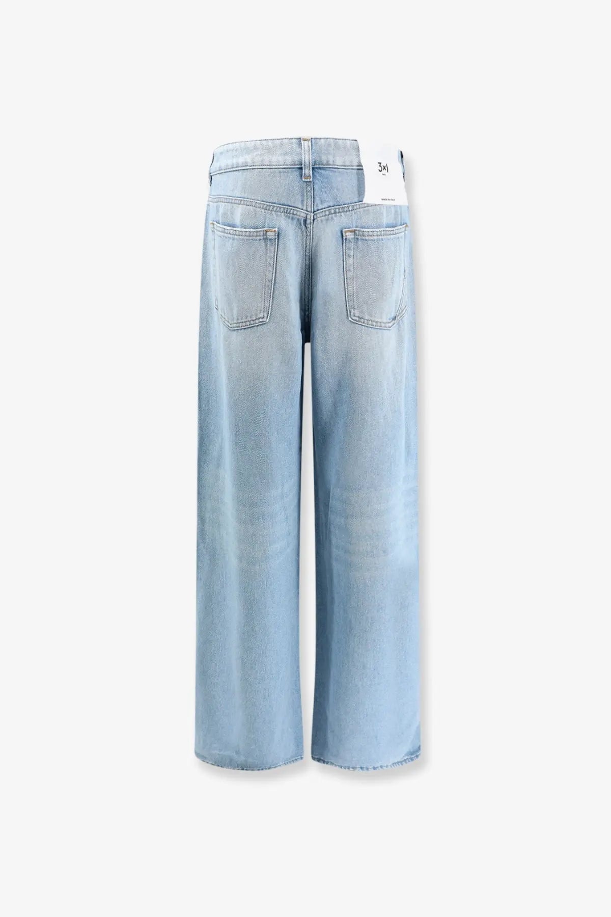 3x1 women’s the kat blue denim jeans in light-wash denim with wide-leg cut shown from the back with classic pockets