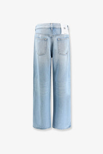 3x1 women’s the kat blue denim jeans in light-wash denim with wide-leg cut shown from the back with classic pockets
