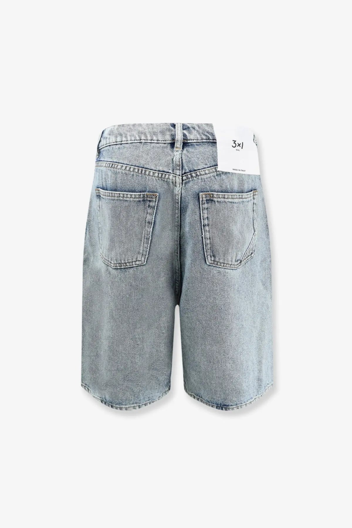 Light-wash 3x1 women’s skater blue denim bermuda shorts with relaxed wide-leg cut and classic back pockets shown from back