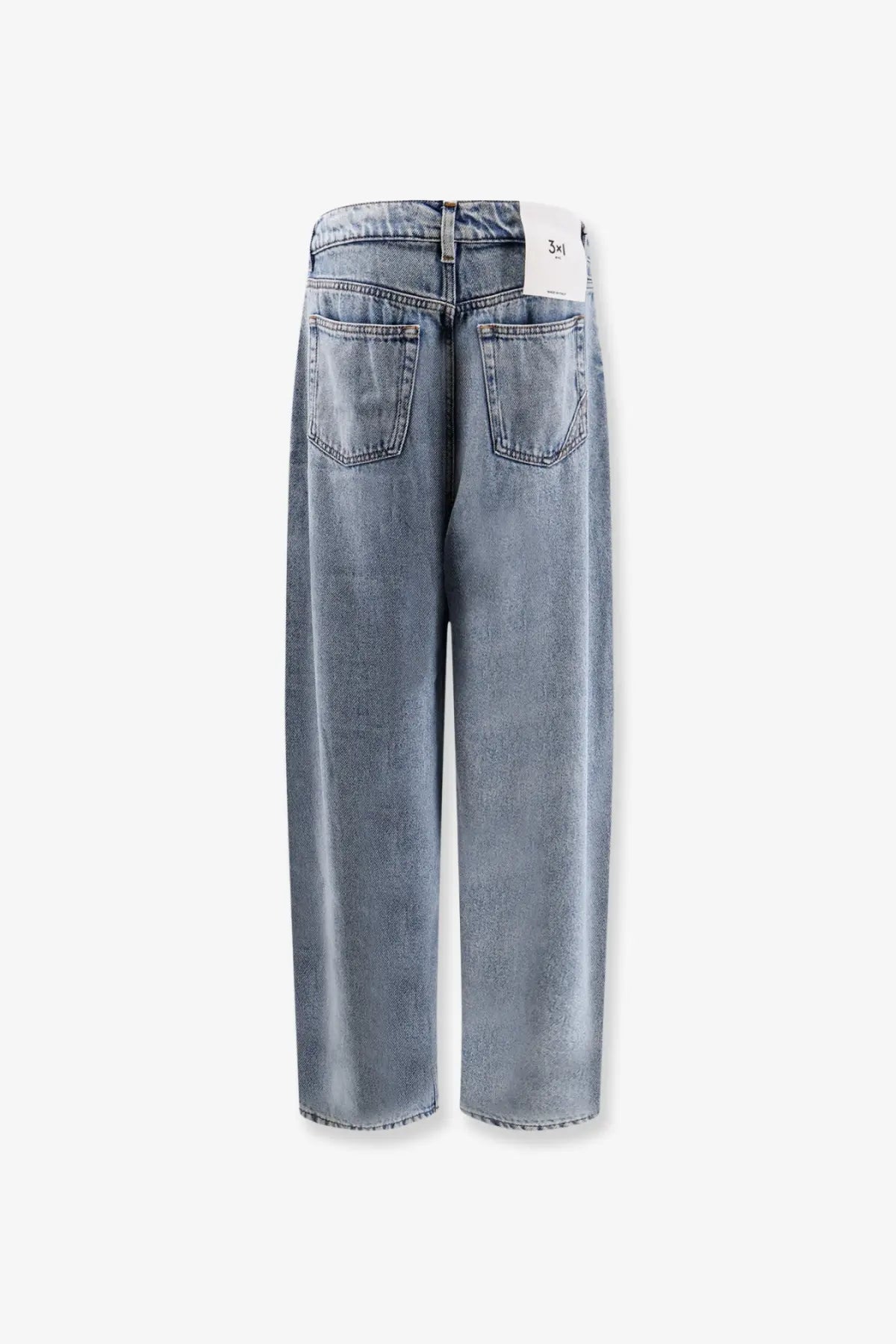 3x1 women’s skater boyfriend jeans in light-wash denim with a relaxed wide-leg cut shown from the back side