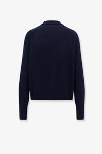 Navy blue knit cardigan with classic collar and long sleeves in wool ideal for women’s turtleneck sweater style