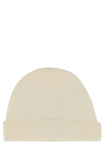 Cream-colored ribbed knit beanie with folded cuff made from lana wool by A.P.C unisex berretto in white