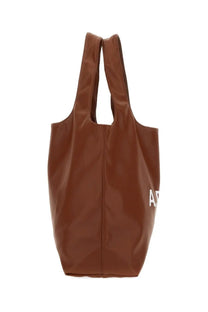 Brown faux leather tote bag with white lettering on the side a.p.c unisex borsa tote ninon beige