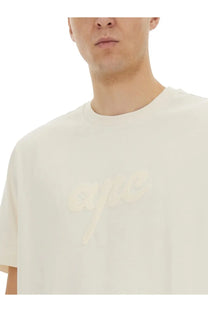 Cream-colored A.P.C unisex crew-neck t-shirt featuring a subtle matching logo across the chest in soft cotton