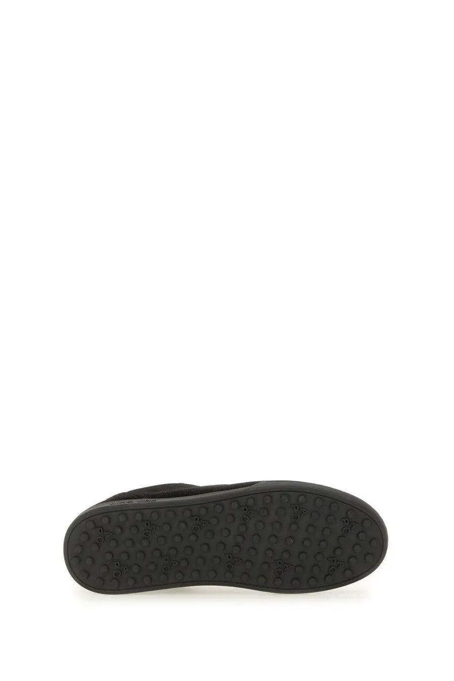 Black rubber sole of a p.c unisex sneaker moe black with textured circular tread pattern visible at the back