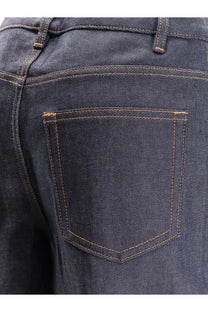 Back side of apc women’s elisabeth jeans in dark blue denim with contrasting tan stitching on the back pocket