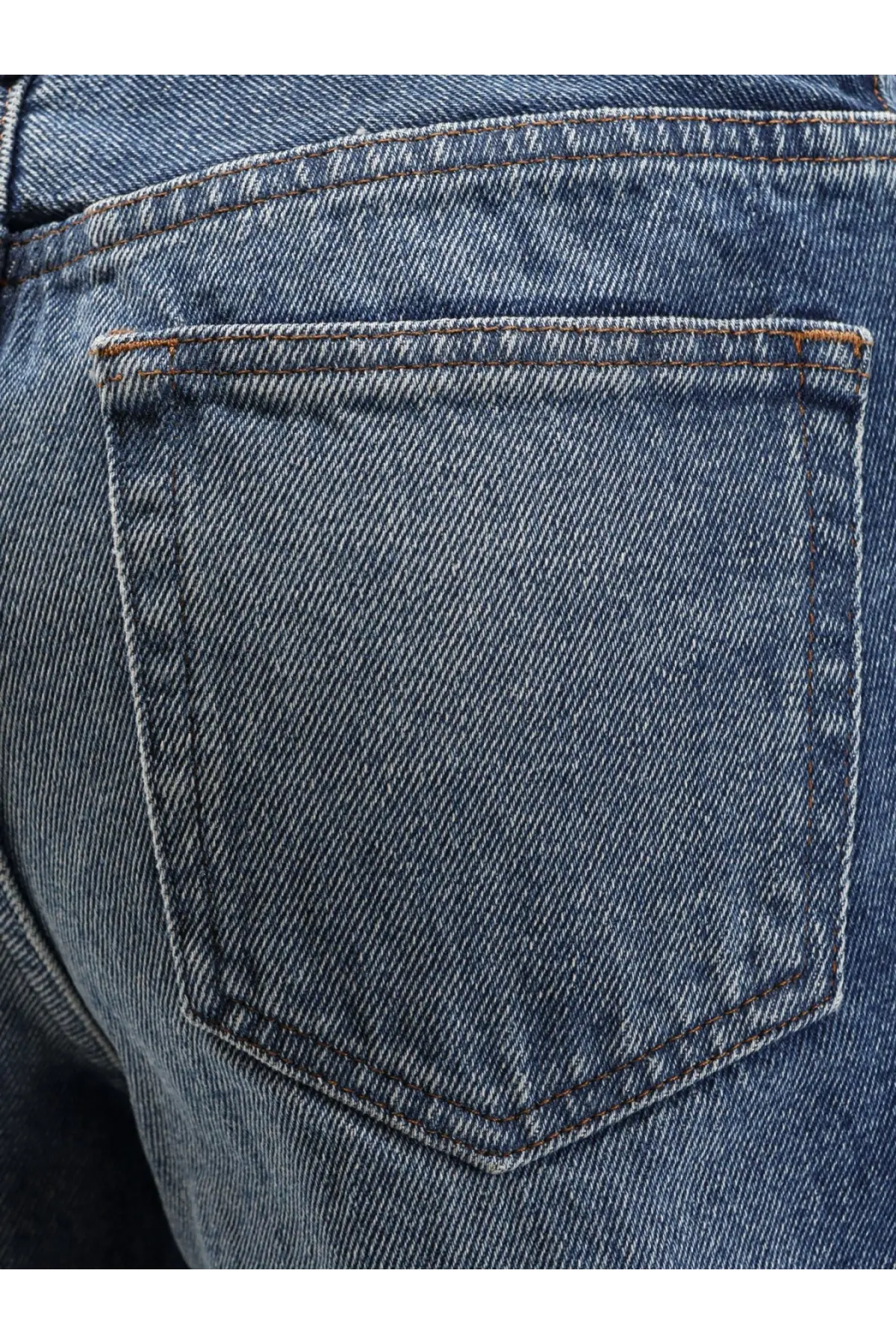 A.p.c women’s elisabeth jeans blue showing back pocket with contrasting brown stitching and diagonal weave texture