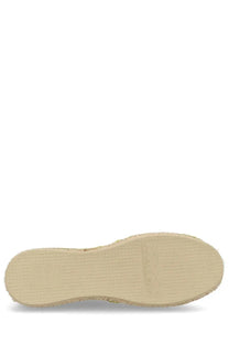 Beige sole of a p.c women’s espadrilla in tela green with woven texture and embossed brand logo visible from back side
