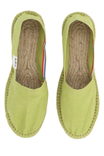 A.P.C women’s espadrilla in tela green light green canvas with braided jute sole and red white blue striped trim