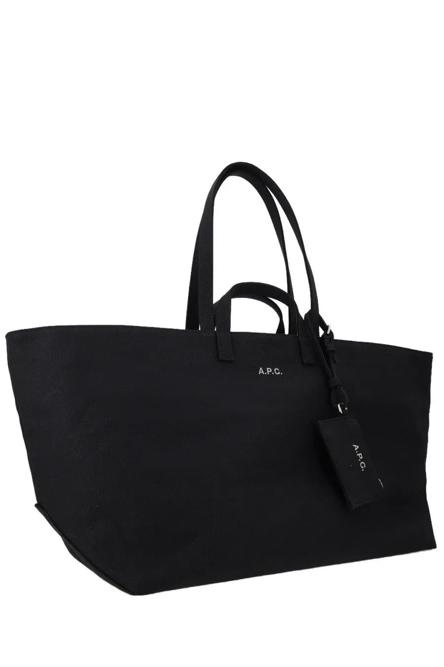 Black canvas tote bag with matching handles and a small a.p.c. tag for women by a.p.c