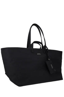 Black canvas tote bag with matching handles and a small a.p.c. tag for women by a.p.c