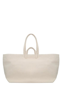 Cream-colored canvas tote bag with two sturdy handles from A.P.C women’s LE Drummer tote bag pink collection