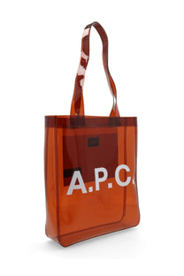 Transparent amber-colored a.p.c. women’s lou tote bag with bold white lettering on the front in brown material