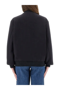 A.P.C women’s Micky jacket blue with sleek minimalist design black bomber style and ribbed cuffs front view
