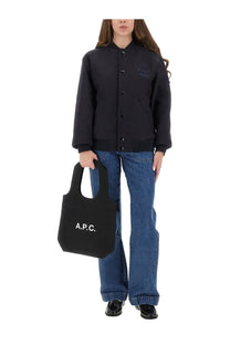 Black canvas tote bag with white apc logo complementing the apc womens micky jacket blue product collection
