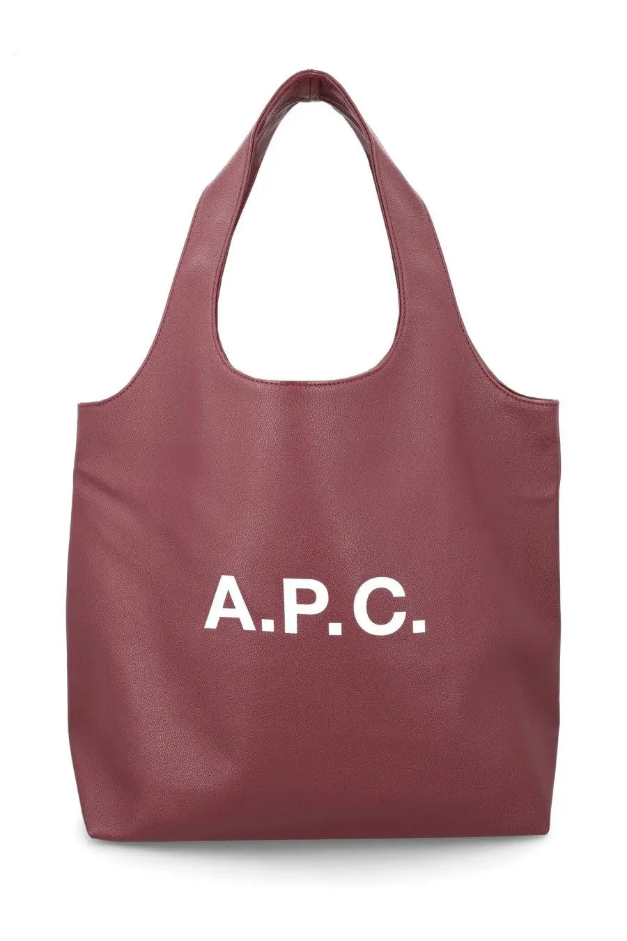 A maroon faux leather tote bag with bold white a.p.c. lettering on the front for women