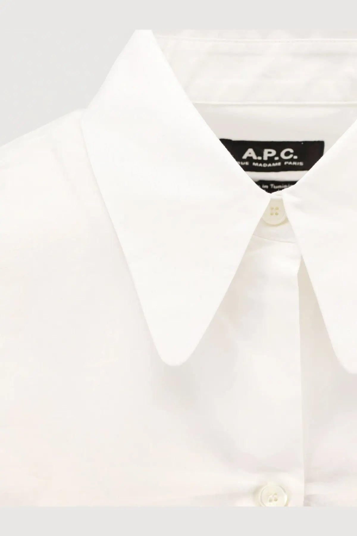White a.p.c women’s organic cotton shirt in white showing the front with a classic fit and breathable fabric