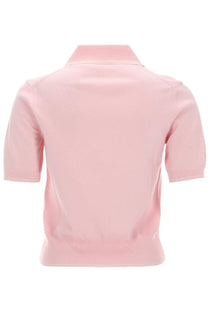 A soft pink knitted polo shirt with short sleeves and a classic collar from A.P.C womens polo lisa blue collection