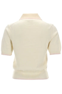 A.P.C women’s cream-colored knit polo shirt with subtle pink trim on collar and sleeve cuffs in lisa white