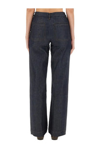 Back view of apc women’s seaside jeans dark indigo denim trousers with straight-leg cut and two back pockets
