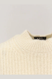 A.P.C women’s cream-colored wool blend sweater with ribbed knit texture and black brand tag at the neckline