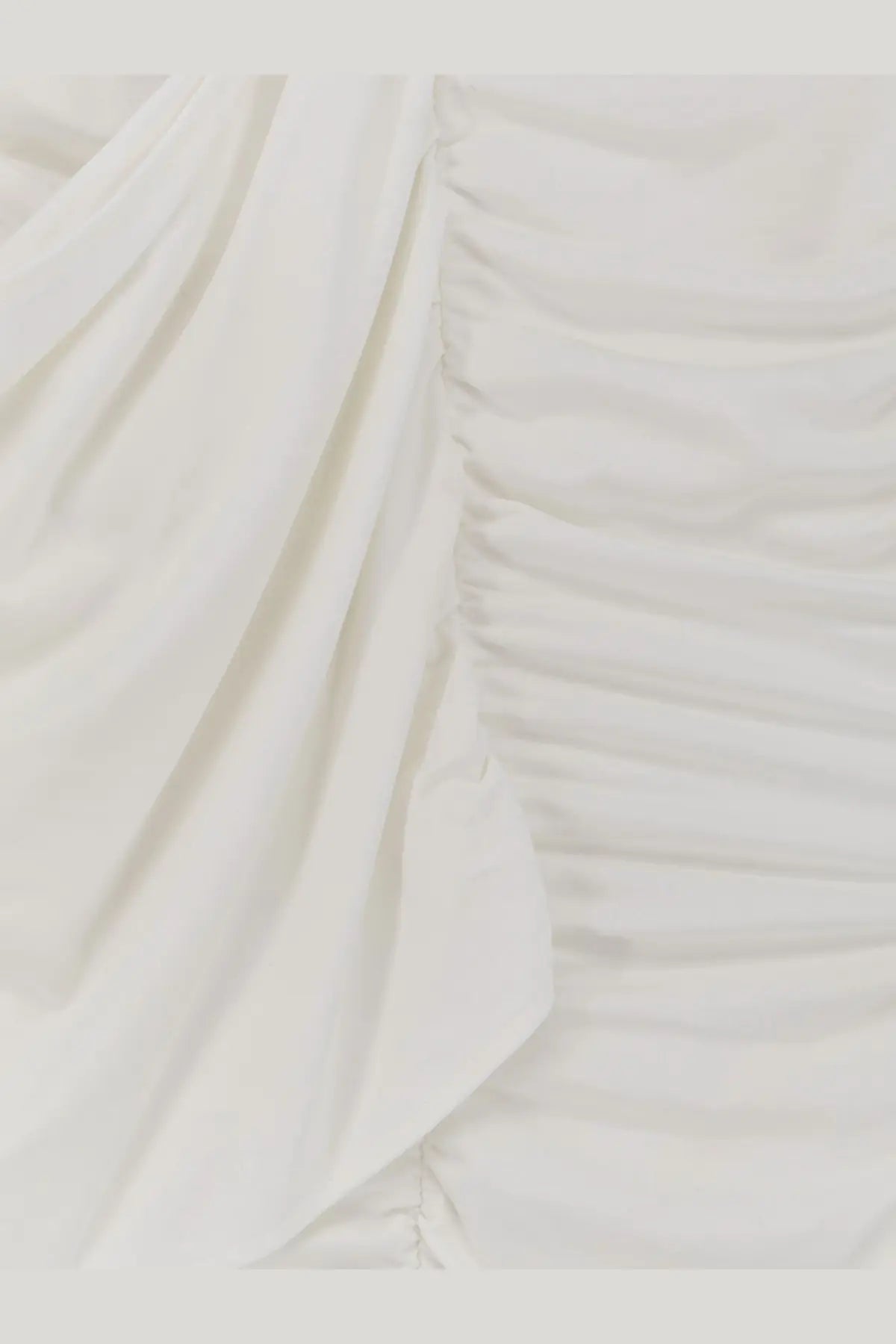 Actualee women’s draped long dress in white soft off-white fabric with gentle ruching and flowing folds