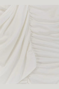 Actualee women’s draped long dress in white soft off-white fabric with gentle ruching and flowing folds