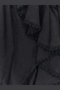 Actualee women’s black shirt featuring ruffled fabric with delicate black pom-pom trim along the edges
