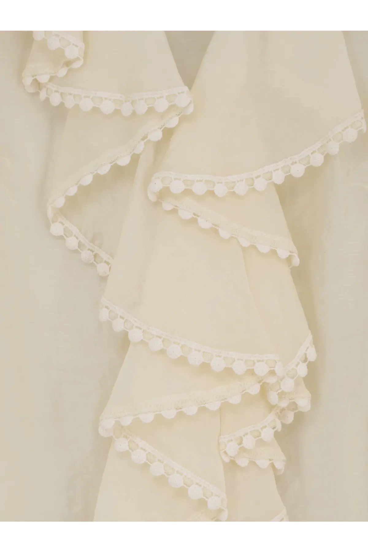 Actualee women’s shirt white with cream-colored ruffled fabric and delicate white pom-pom trim along each layer