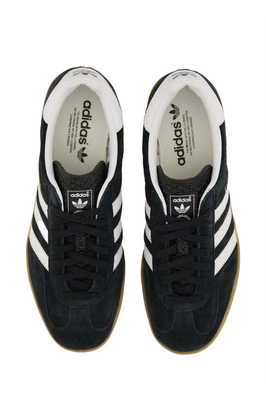 Adidas men’s gazelle indoor sneaker in black suede with white three-stripe detailing and gum rubber soles