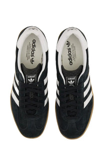 Adidas men’s gazelle indoor sneaker in black suede with white three-stripe detailing and gum rubber soles