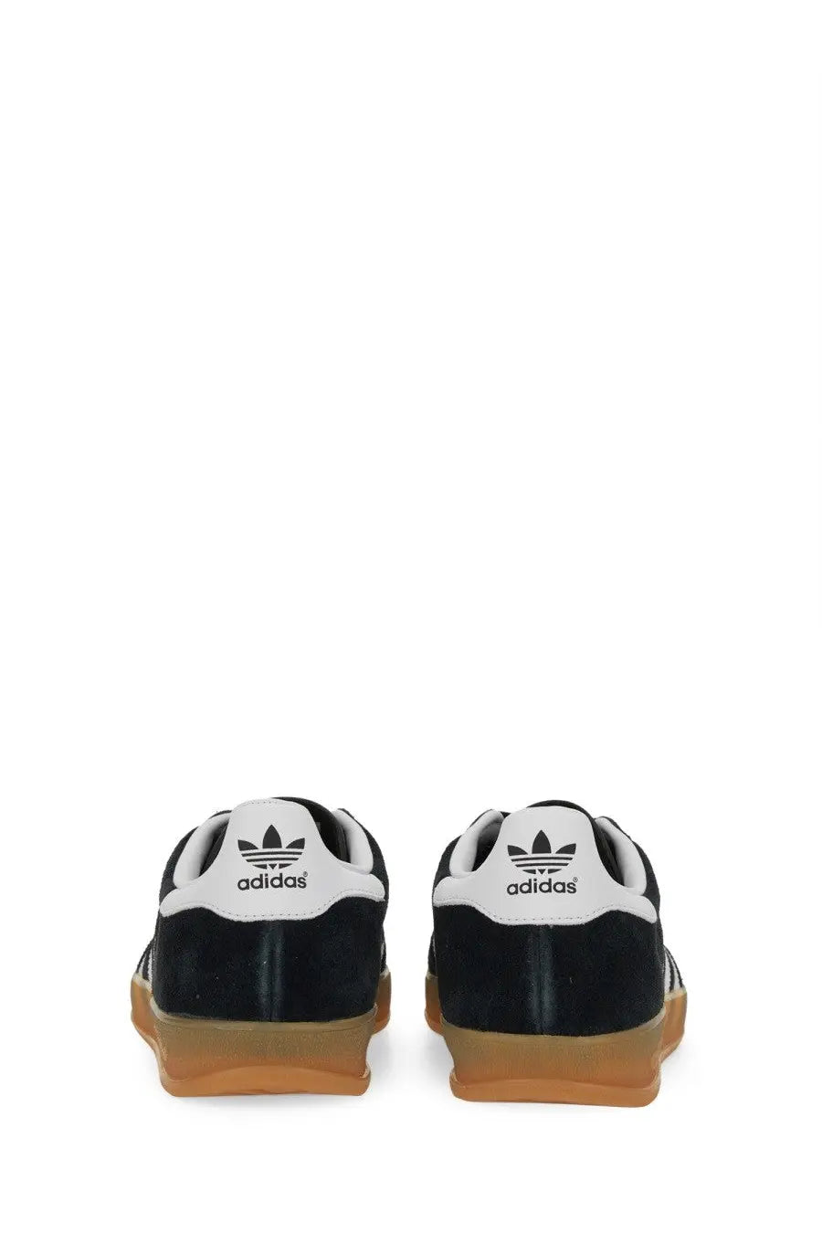 Black suede adidas men’s gazelle indoor sneaker with white heel tabs and gum-colored rubber soles shown from the back