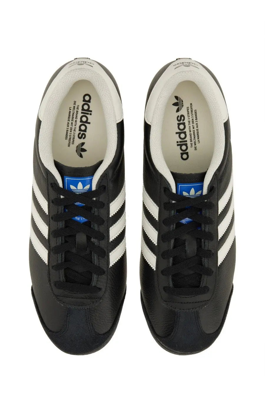 Adidas men’s kick sneaker in black with white three stripes and blue branding accents for casual wear