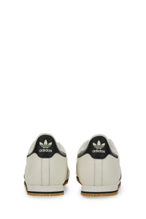 Adidas men’s kick sneaker white featuring white leather samba sneakers with black heel tabs and gum rubber soles