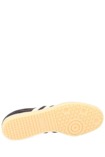 Adidas men’s samba OG sneaker in black leather with white stripes and pale yellow rubber sole for casual wear