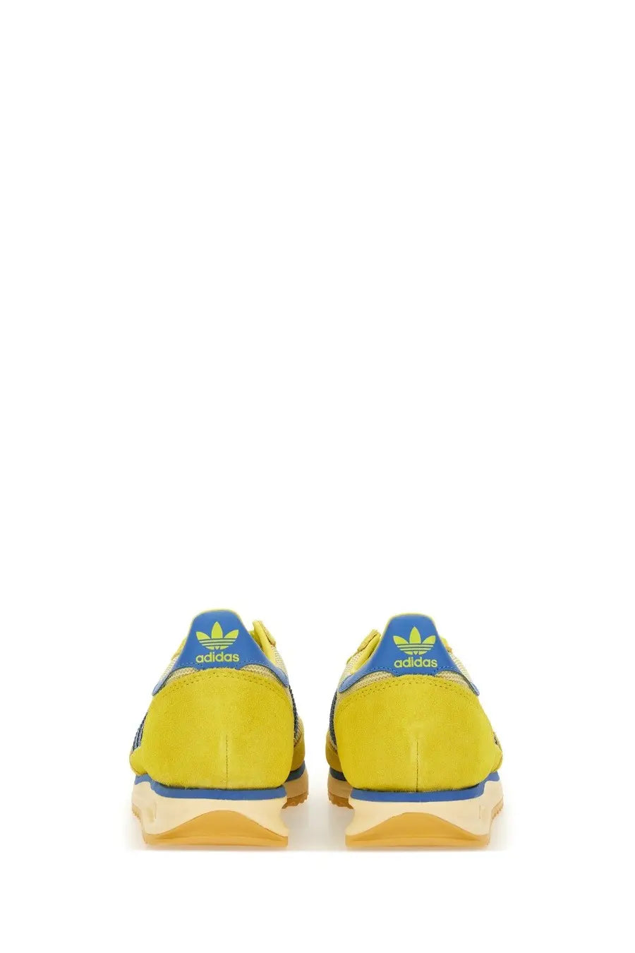 Adidas men’s sneaker in bright yellow with blue accents and gum-colored sole in a multicolor design