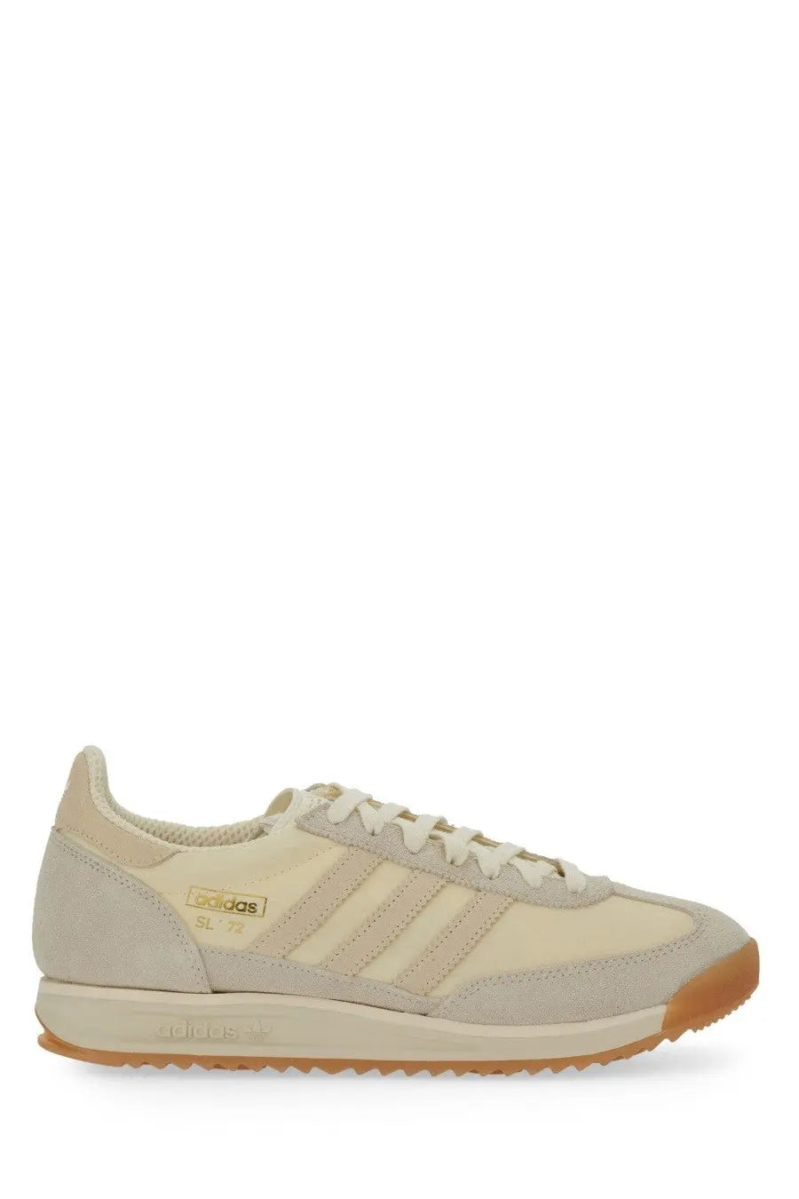 Cream-colored adidas men’s sl 1978 sneaker with suede and canvas upper and tan rubber sole in white style