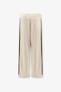 Adidas originals by wales bonner men’s cream recycled nylon track pants with wide legs black side stripes and elastic waist