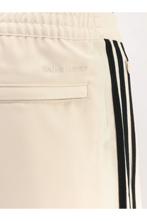 Adidas originals by wales bonner men’s cream athletic nylon trousers with black stripes and cream balenciaga logo embroidery