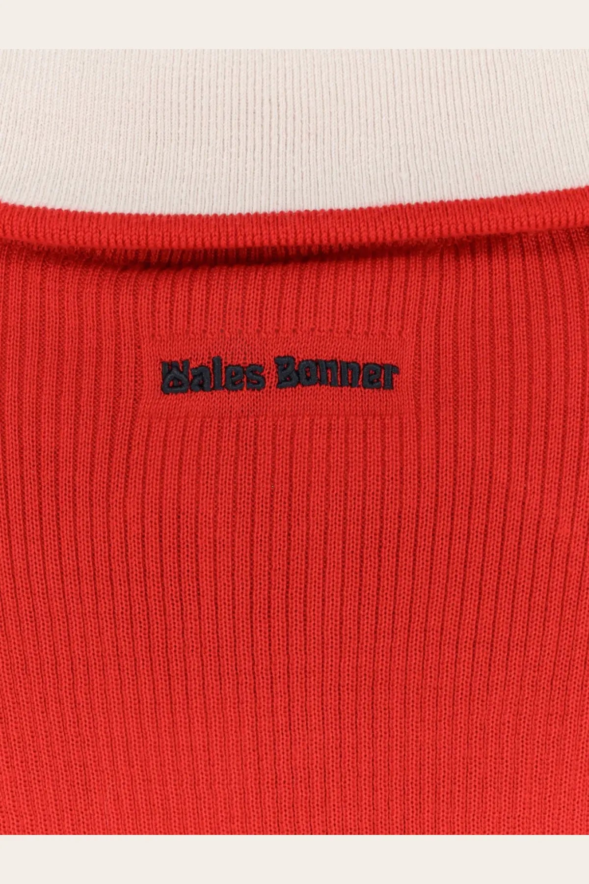 Bright red ribbed knit top with black embroidered bales banner logo at neckline in adidas Originals by Wales Bonner